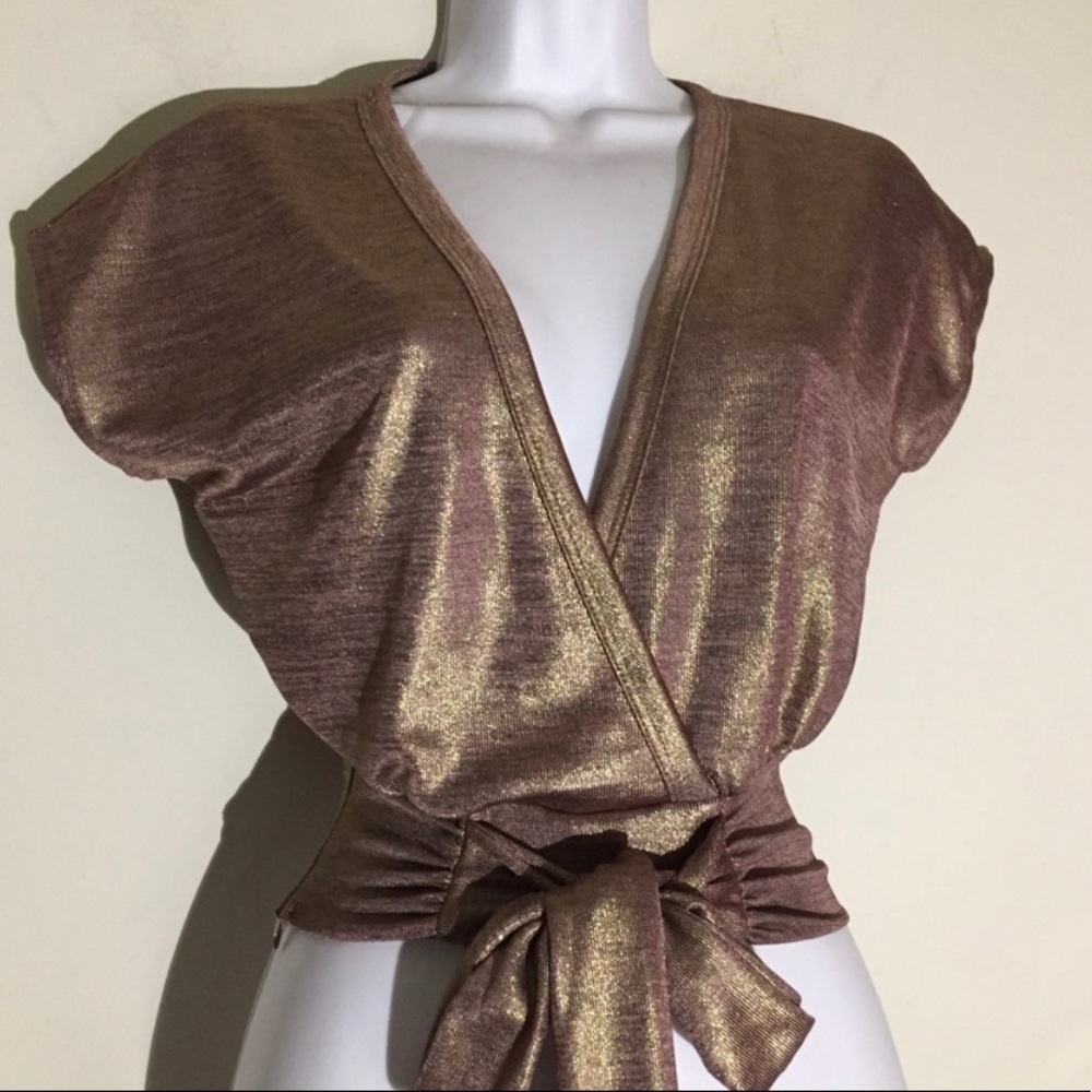 Rose gold Fashion Nova top with plunging neckline and front detail!